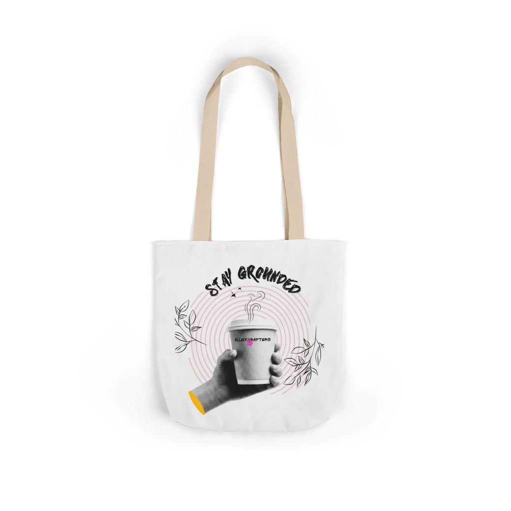 White coffee tote with beige handles, “STAY GROUNDED” graphic and coffee mug front