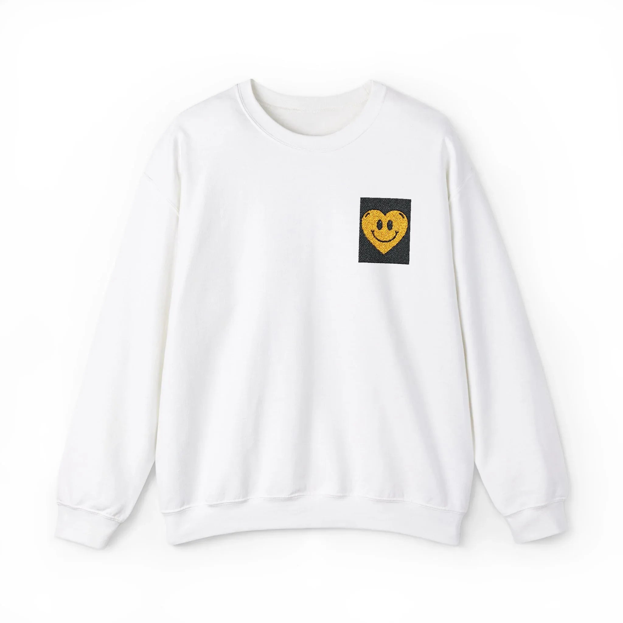White crewneck sweatshirt with embroidered smiley heart patch on chest
