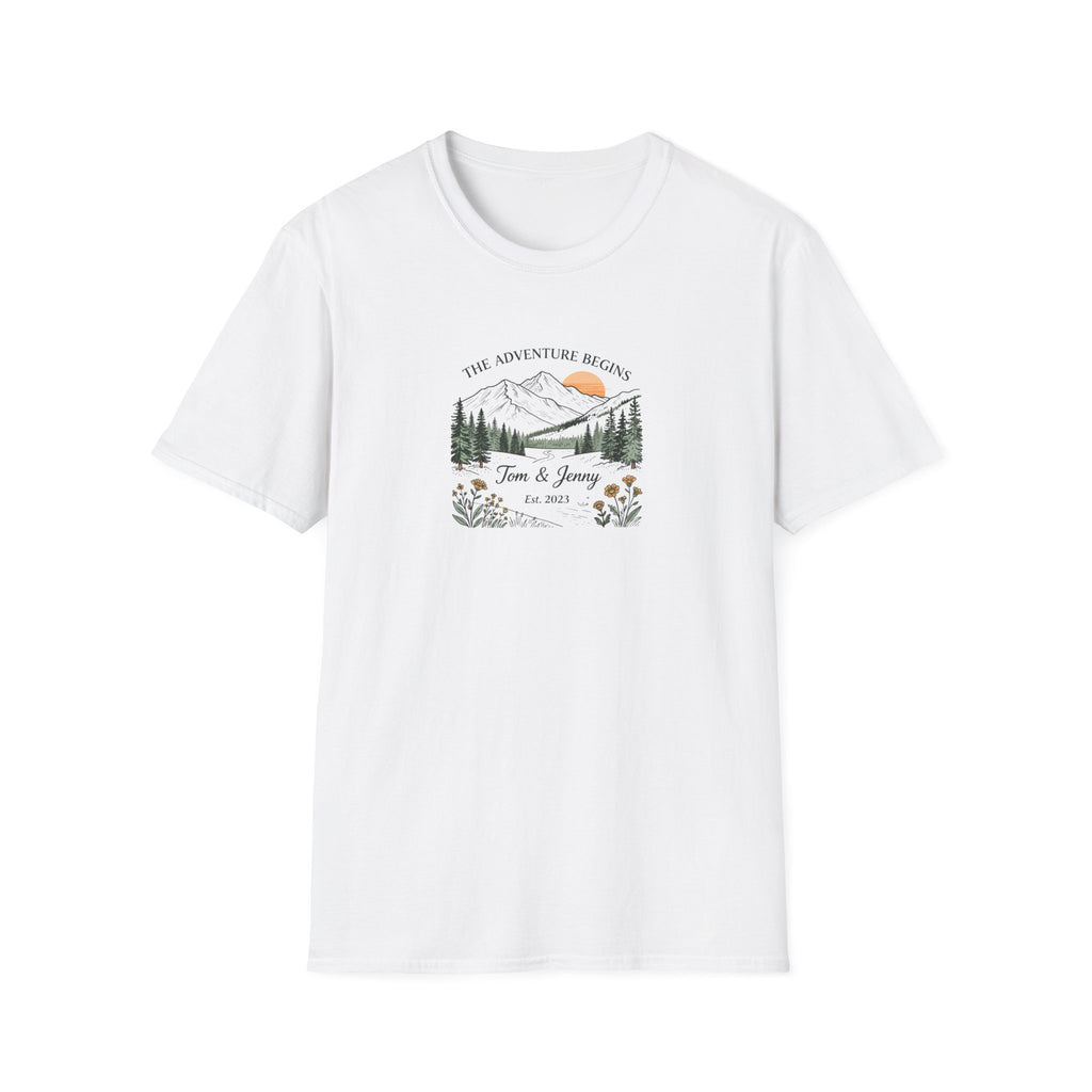 White t-shirt with front print: “The Adventure Begins” mountain scene, Tom & Jenny, floral accents