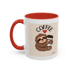 White coffee mug with red interior and handle, sloth graphic holding a coffee cup