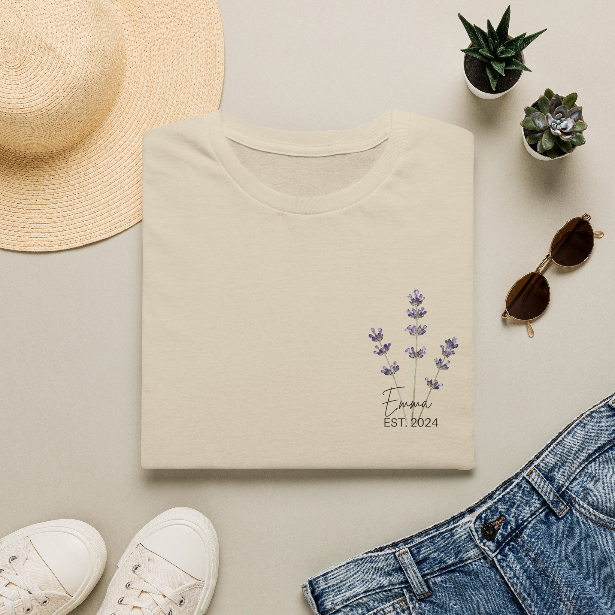 Personalised lavender sprig t-shirt in sand — front view showing custom name and year chest print