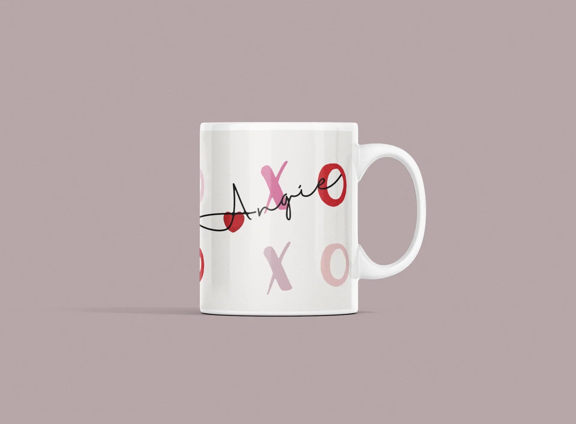 White ceramic mug with custom name “Annie” and XO heart accents in red
