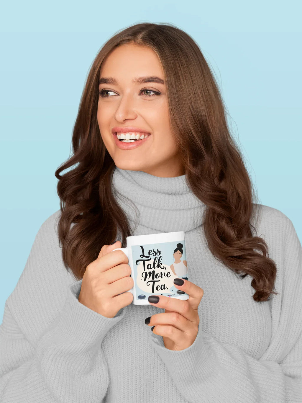 Person holding a tea mug with 'Less Talk, More Tea' text and woman illustration