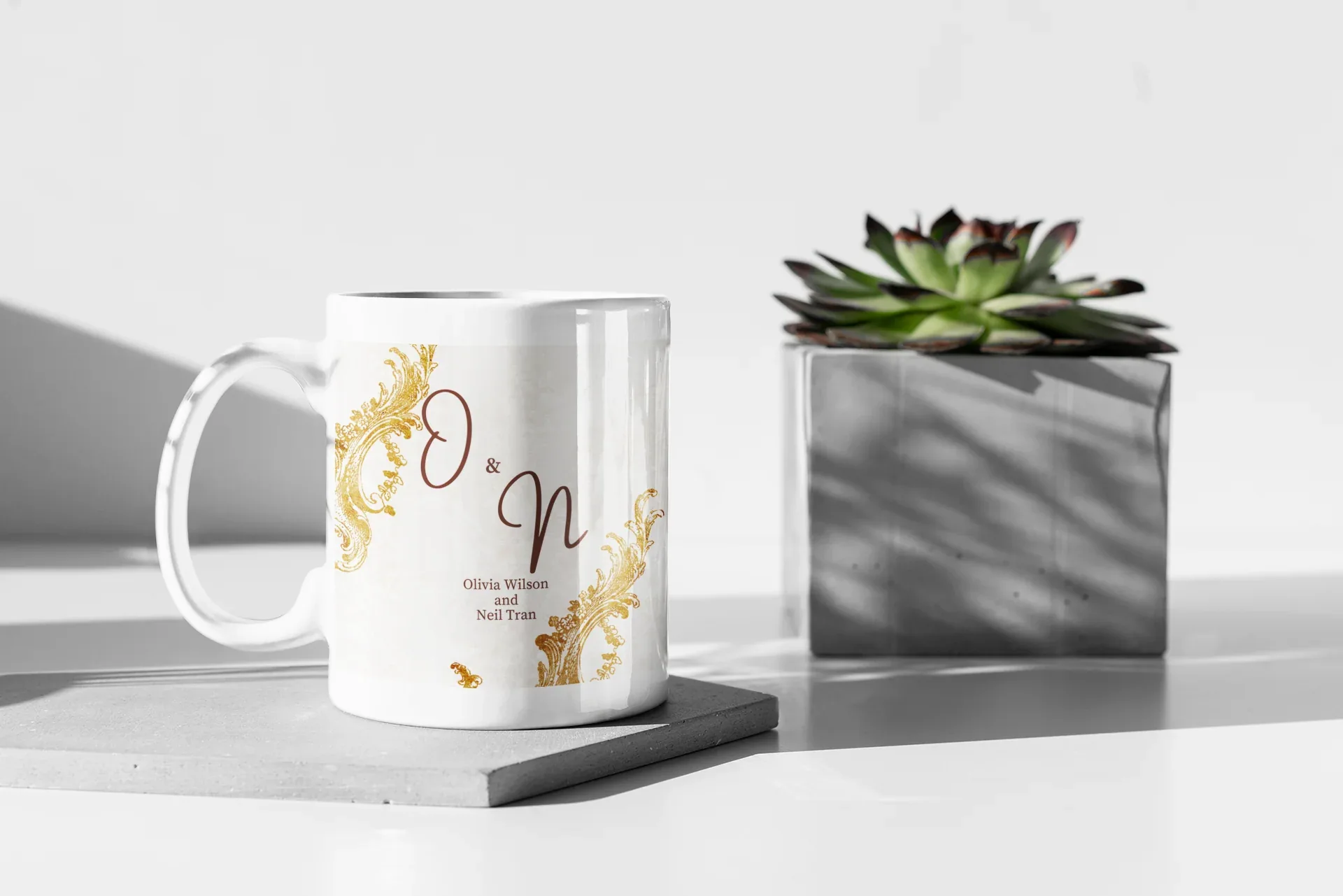 White mug with gold ornate border, initials O & N, and small gold decorative accents