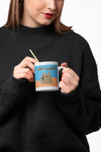 Dog graphic ceramic mug with blue “JUST LIVING” design, held with chopsticks