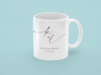 White ceramic mug with monogram k + l and date 11.02.2030, printed on side.