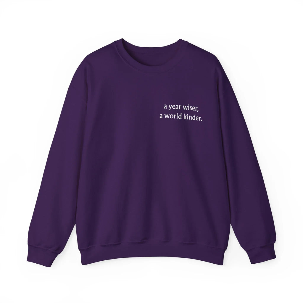 Purple birthday sweatshirt with 'a year wiser, a world kinder' print