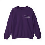 Purple birthday sweatshirt with 'a year wiser, a world kinder' print