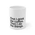 White ceramic coffee mug with black quote text on the front, cropped view.