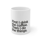 White ceramic coffee mug with black quote text on the front, cropped view.