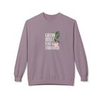 Lavender crewneck sweatshirt with “Grow What You Go Through” graphic and green leaf