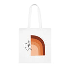 White cotton tote bag with terracotta abstract arch print and black signature on front