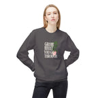 Dark gray sweatshirt with front “Grow What You Go Through” graphic.