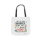 White tote bag with black handles and colorful quote graphic
