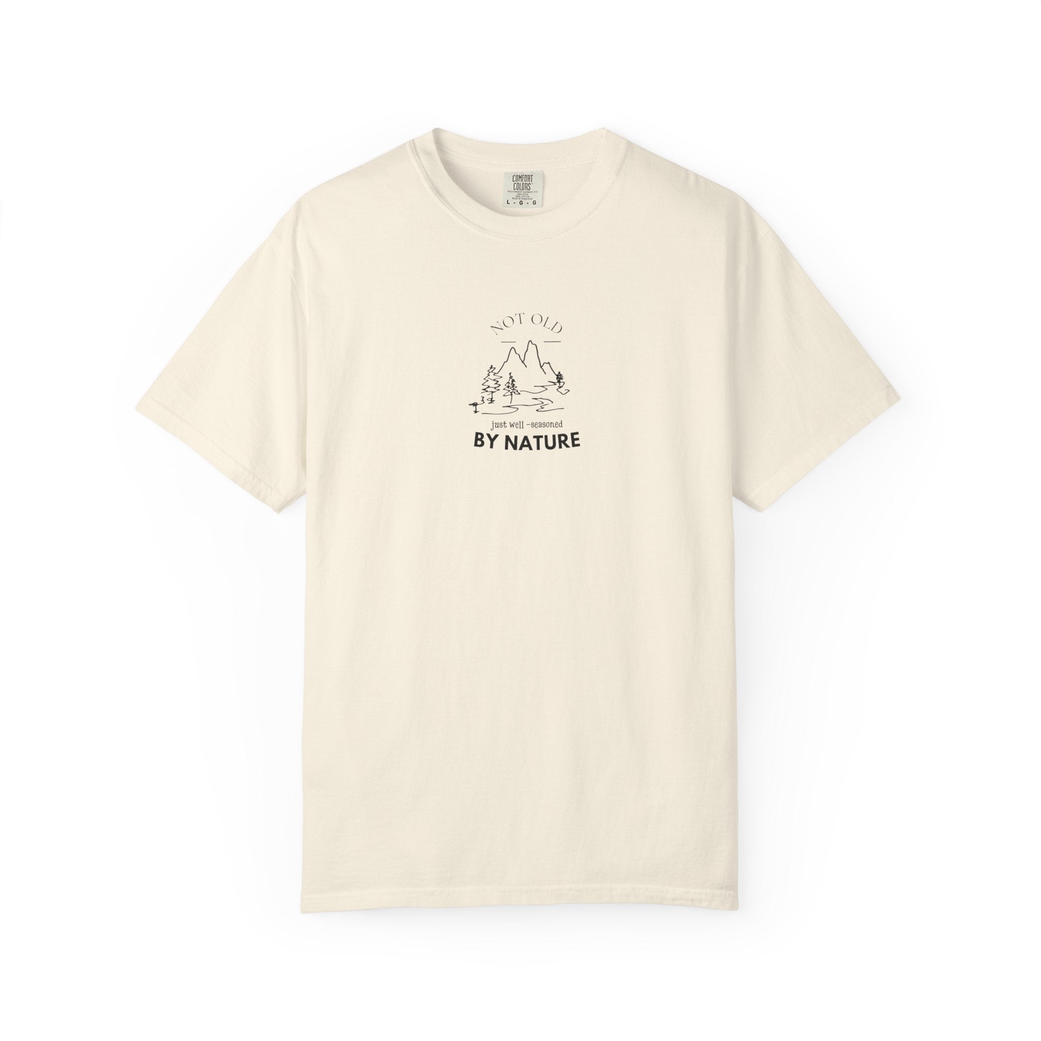 Cream nature graphic t-shirt with centered “BY NATURE” mountain and tree print