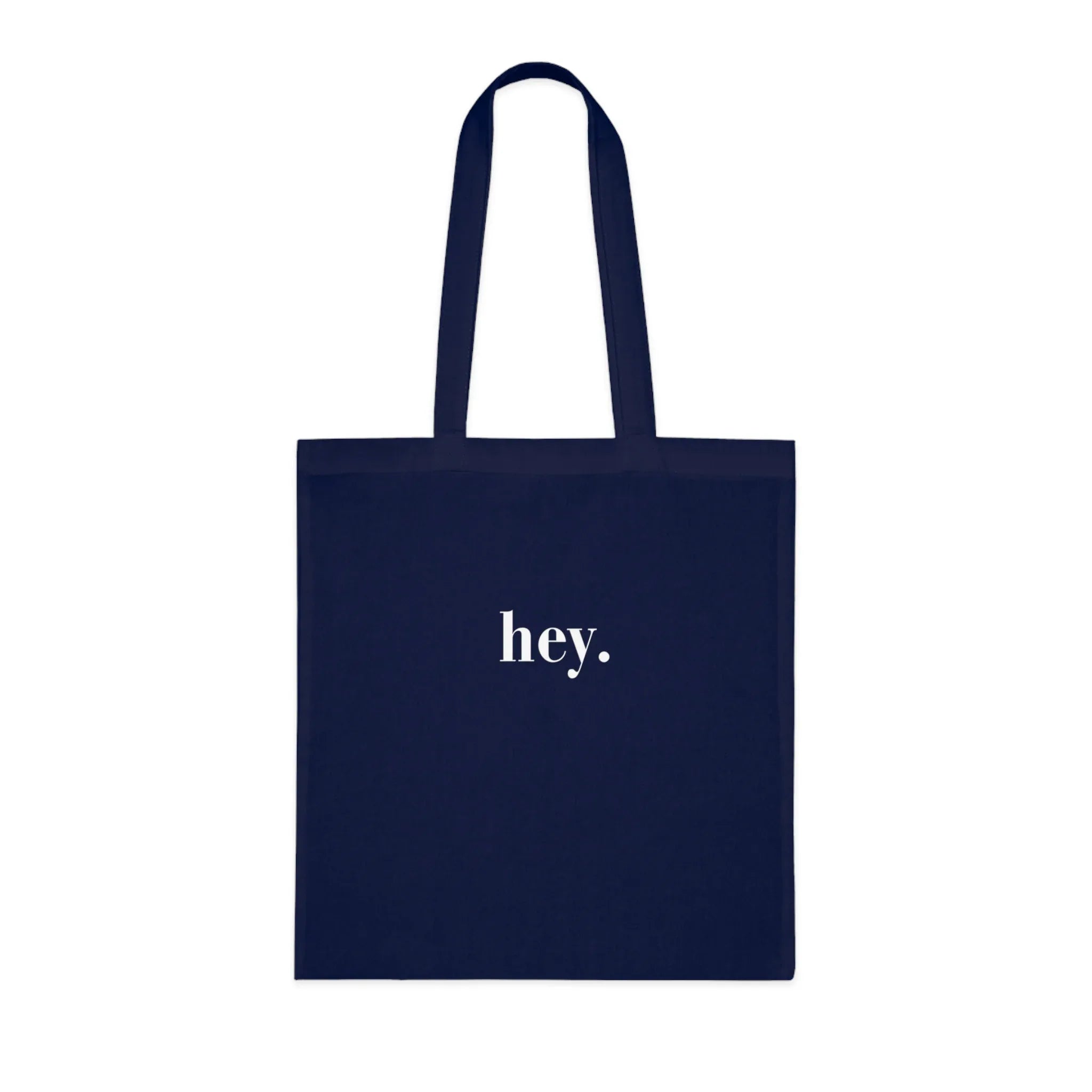 Dark navy cotton tote bag with custom text "hey."