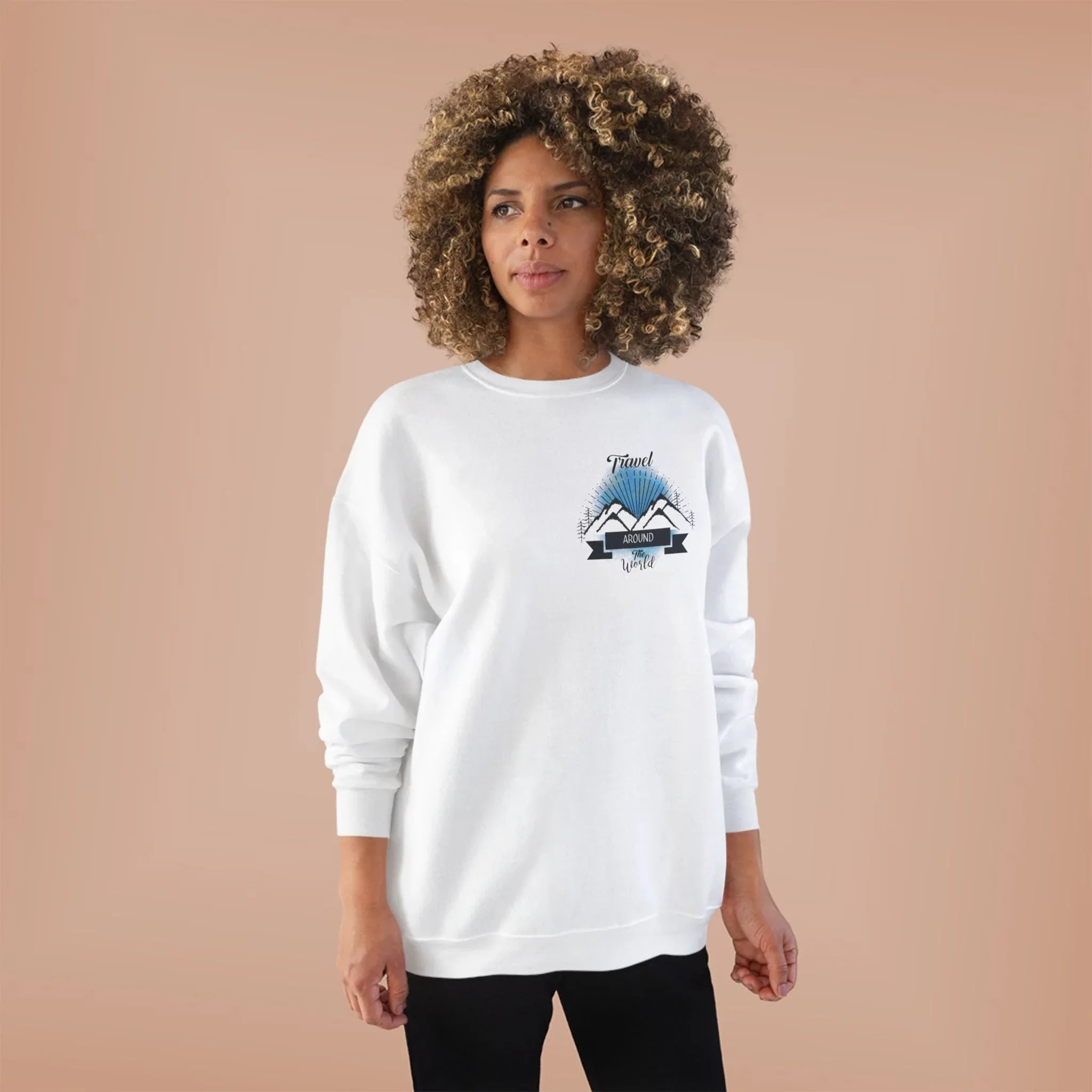 White crewneck sweatshirt with long sleeves and travel-themed chest logo graphic