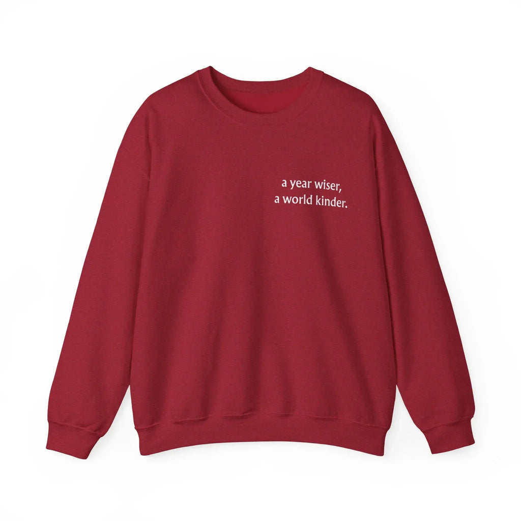 Maroon crewneck sweatshirt with 'a year wiser, a world kinder.' print