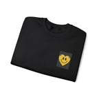 Black crewneck sweatshirt with embroidered smiley heart patch on chest