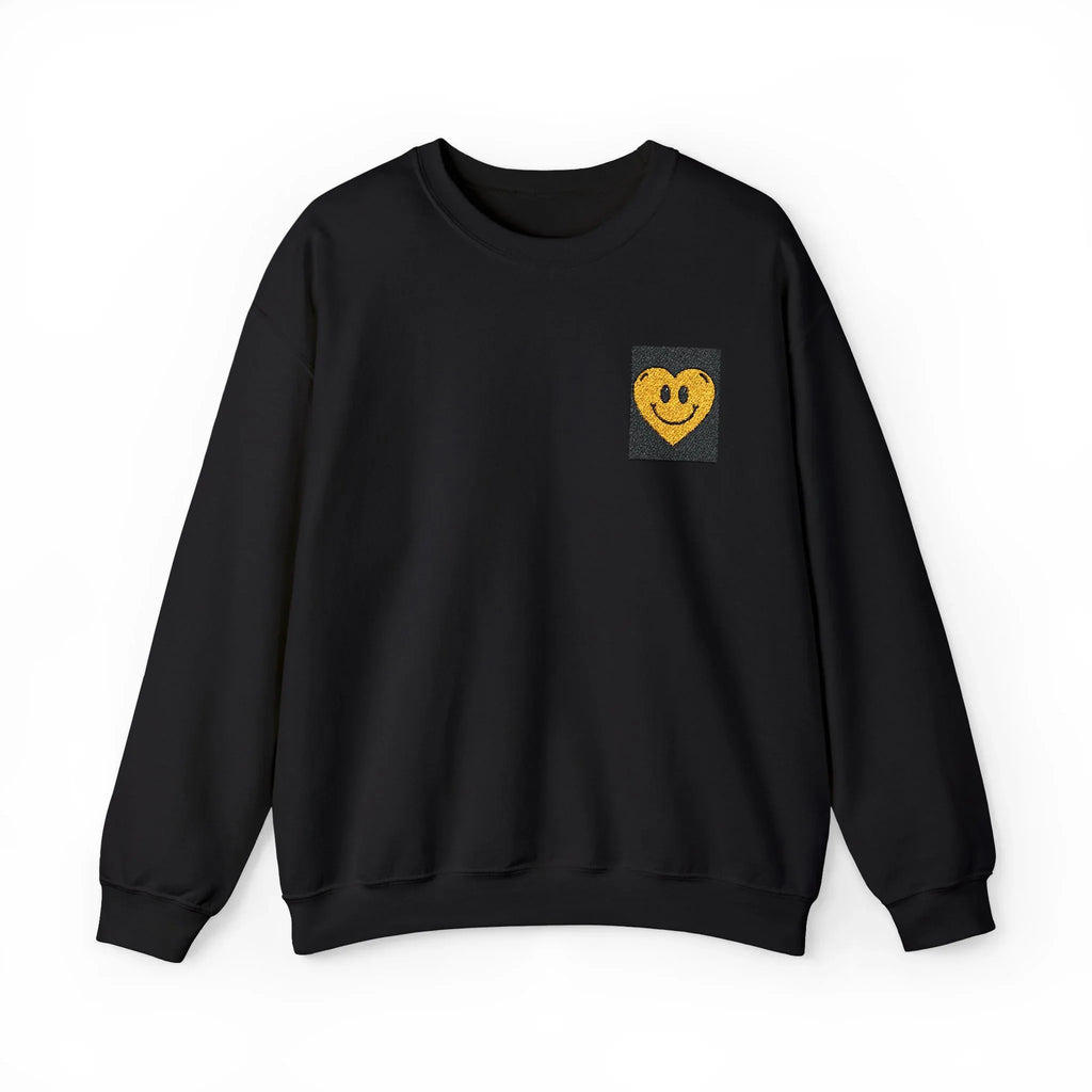Black crewneck sweatshirt with embroidered smiley heart patch on chest