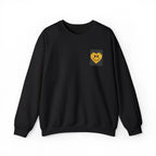 Black crewneck sweatshirt with embroidered smiley heart patch on chest
