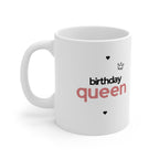 White ceramic mug with 'birthday queen' text, hearts, and crown icon on front