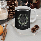 Black ceramic coffee mug with white handle, hot coffee and floral coffee-cup quote design