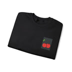 Black sweatshirt folded flat with cherry embroidery patch on the left chest