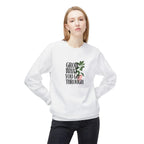 White crewneck sweatshirt with “Grow What You Go Through” graphic and green leaf