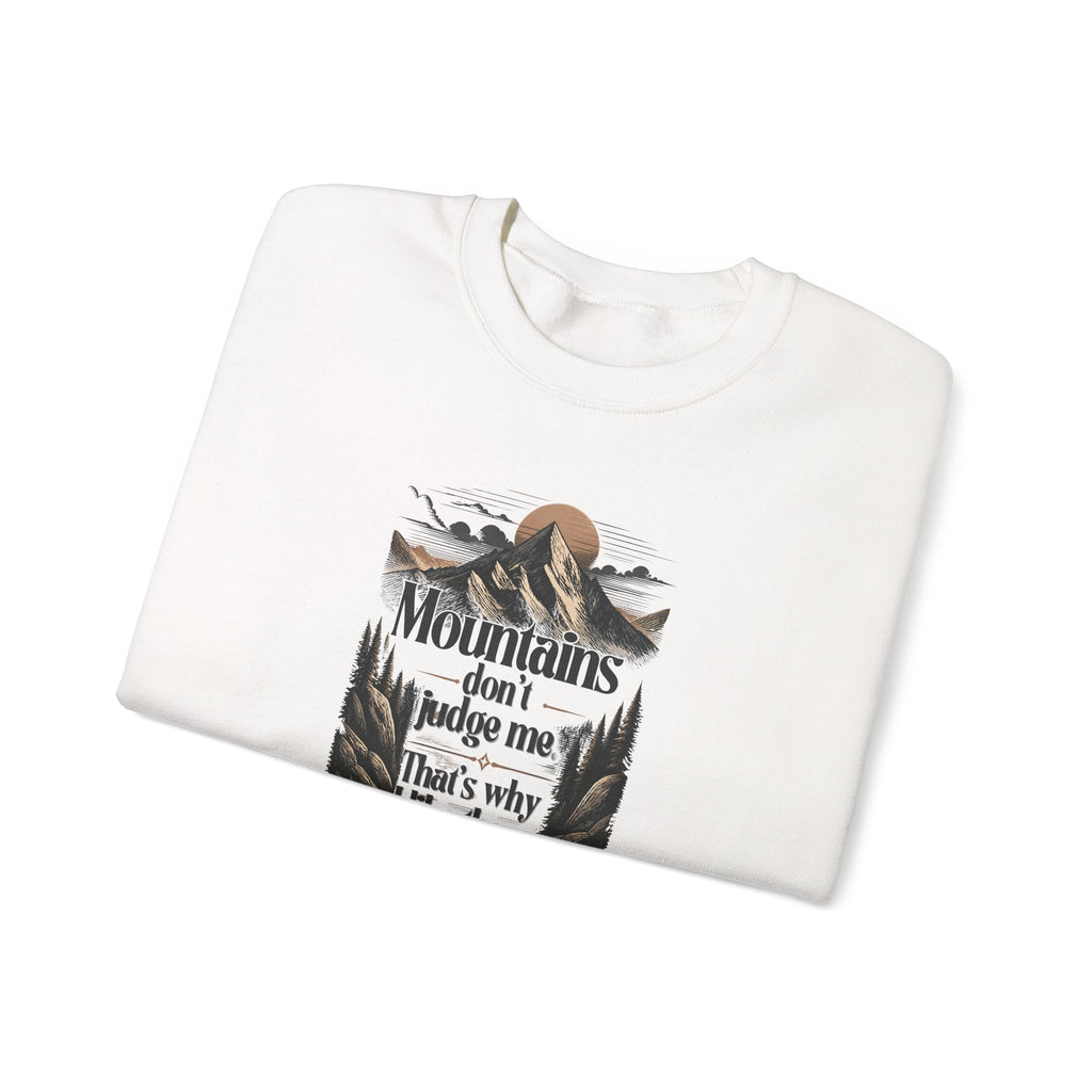 White folded sweatshirt with front mountain quote graphic print