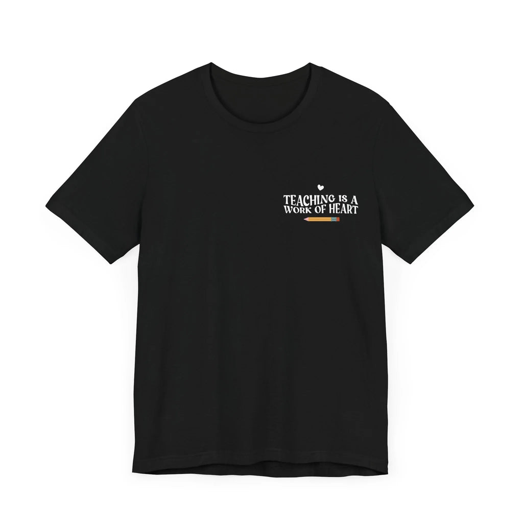Black unisex t-shirt with “Teaching is a work of heart” heart-and-text graphic