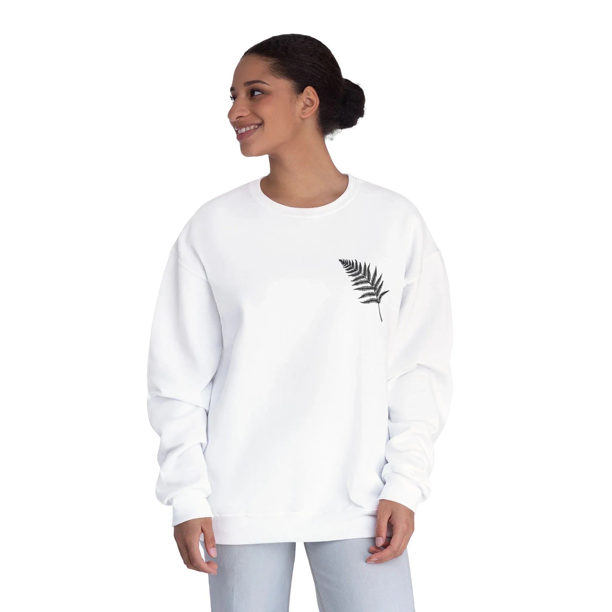 White sweatshirt with crew neck and small fern graphic on the right chest