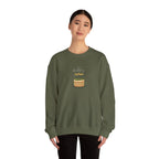 Olive green crewneck sweatshirt with “Happy birthday” cake and candle graphic