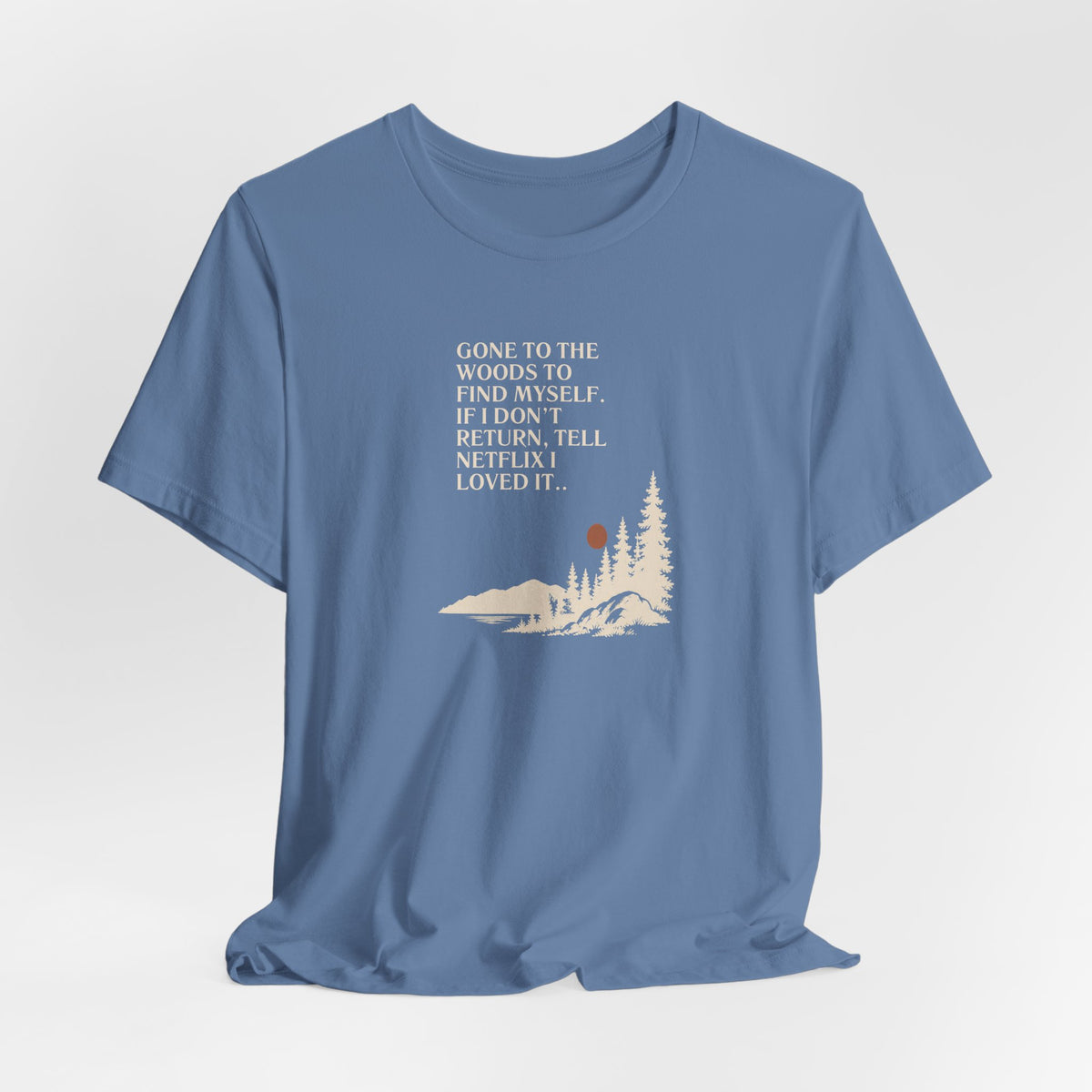 Lavender blue hiking T-shirt with woods scene graphic and quote text on front