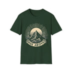 Green short-sleeve T-shirt with mountain sunrise “RISE ABOVE” graphic
