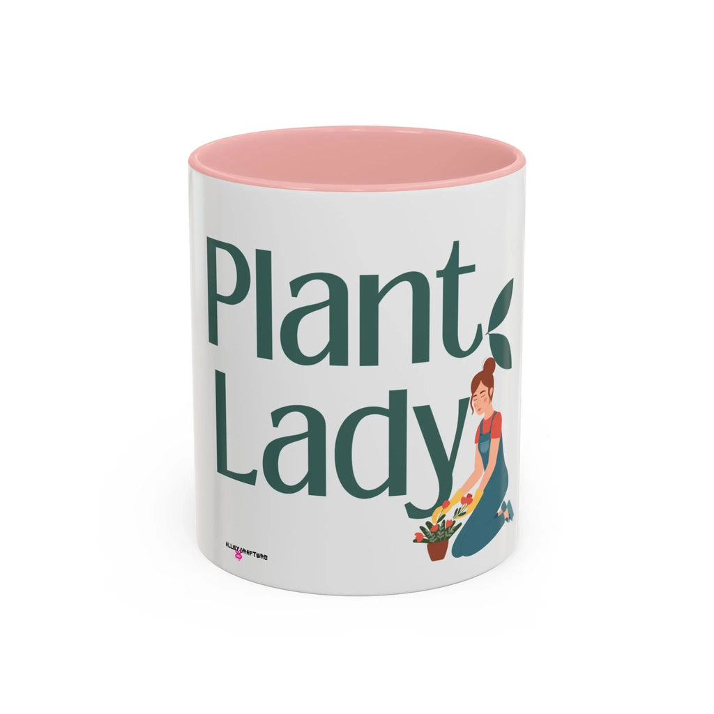 White coffee mug with pink interior, large green “Plant Lady” text and plants