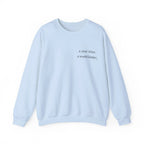 Light blue birthday sweatshirt with 'a year wiser, a world kinder' print
