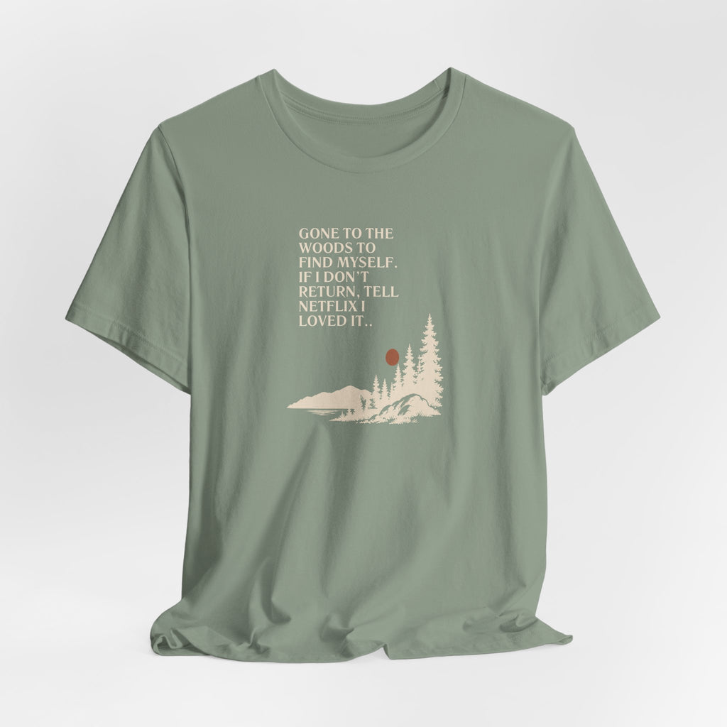 Sage green hiking T-shirt with woods scene graphic and quote text on front