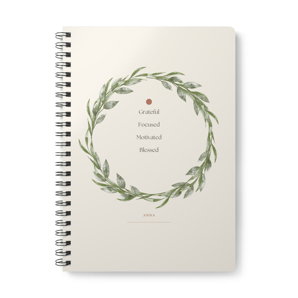 A5 spiral notebook, floral wreath cover with “Grateful Focused Motivated Blessed”