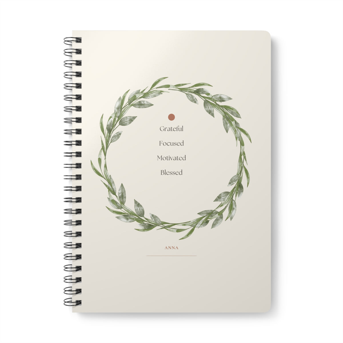 A5 spiral notebook, floral wreath cover with “Grateful Focused Motivated Blessed”