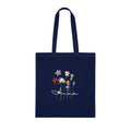 Navy cotton tote bag with dried wildflower illustration and name "Anna".