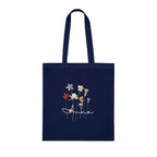Navy cotton tote bag with dried wildflower illustration and name "Anna".