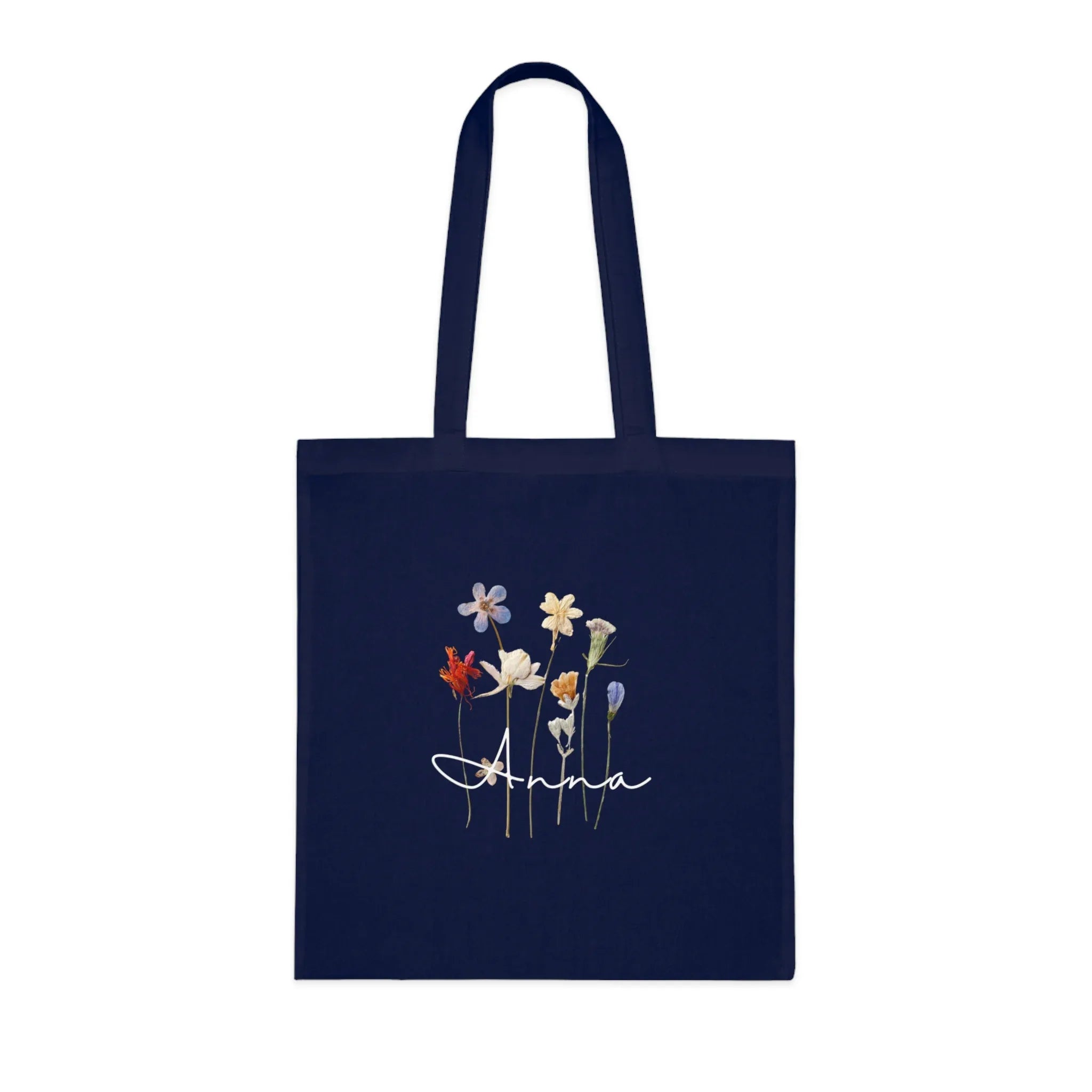 Navy cotton tote bag with dried wildflower illustration and name "Anna".