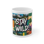 White ceramic mug with 'STAY WILD!' colorful collage print, front view