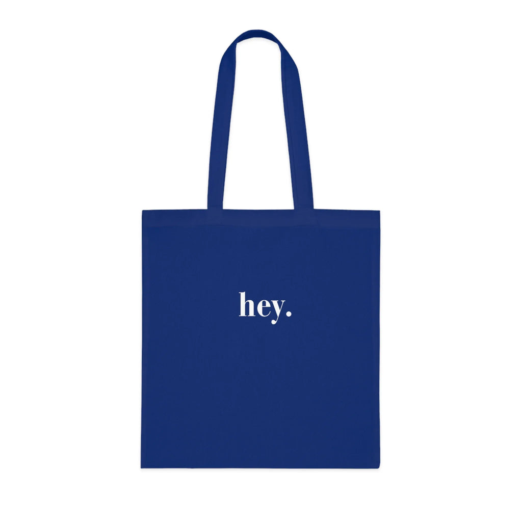 Royal blue cotton tote bag with custom text "hey."