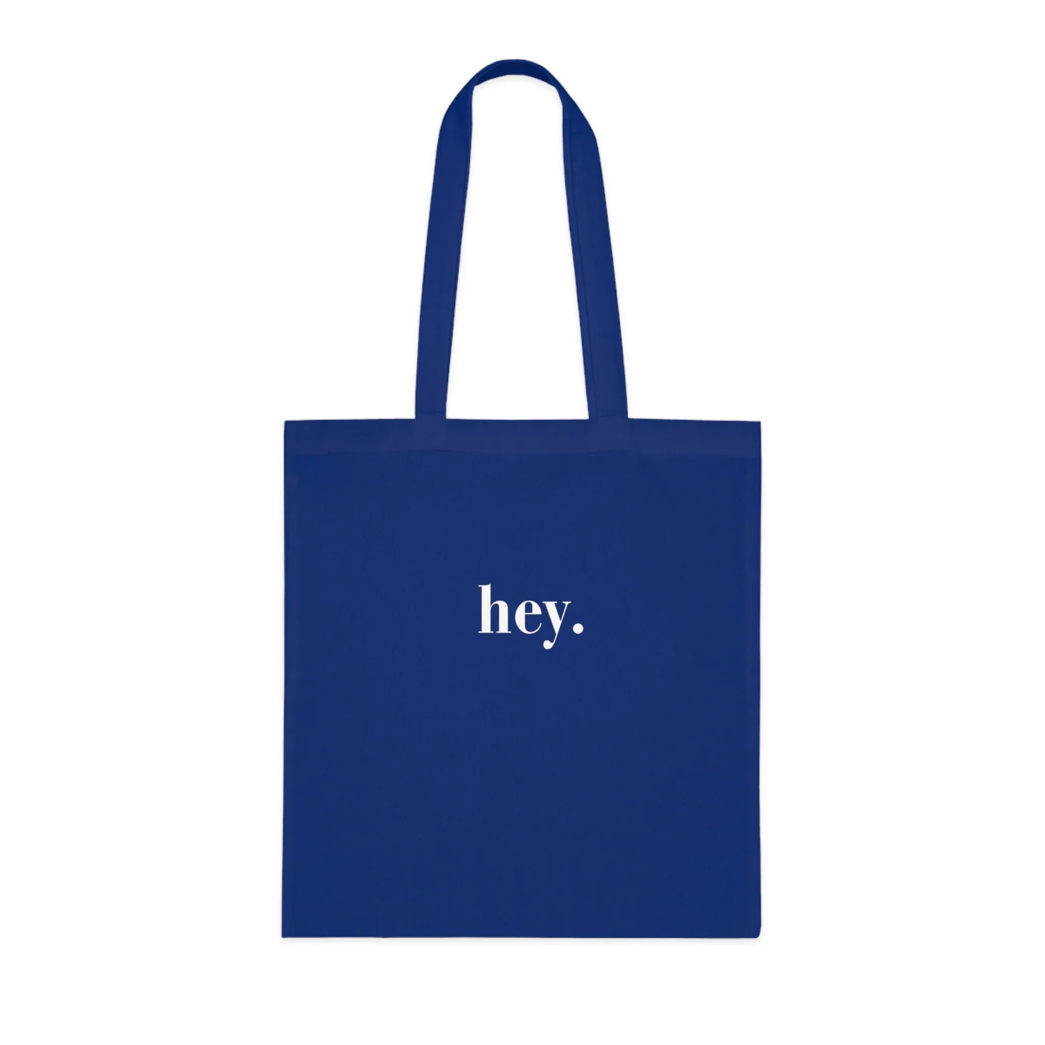 Royal blue cotton tote bag with custom text "hey."