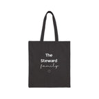 Black canvas tote bag with handles and “The Steward family” text