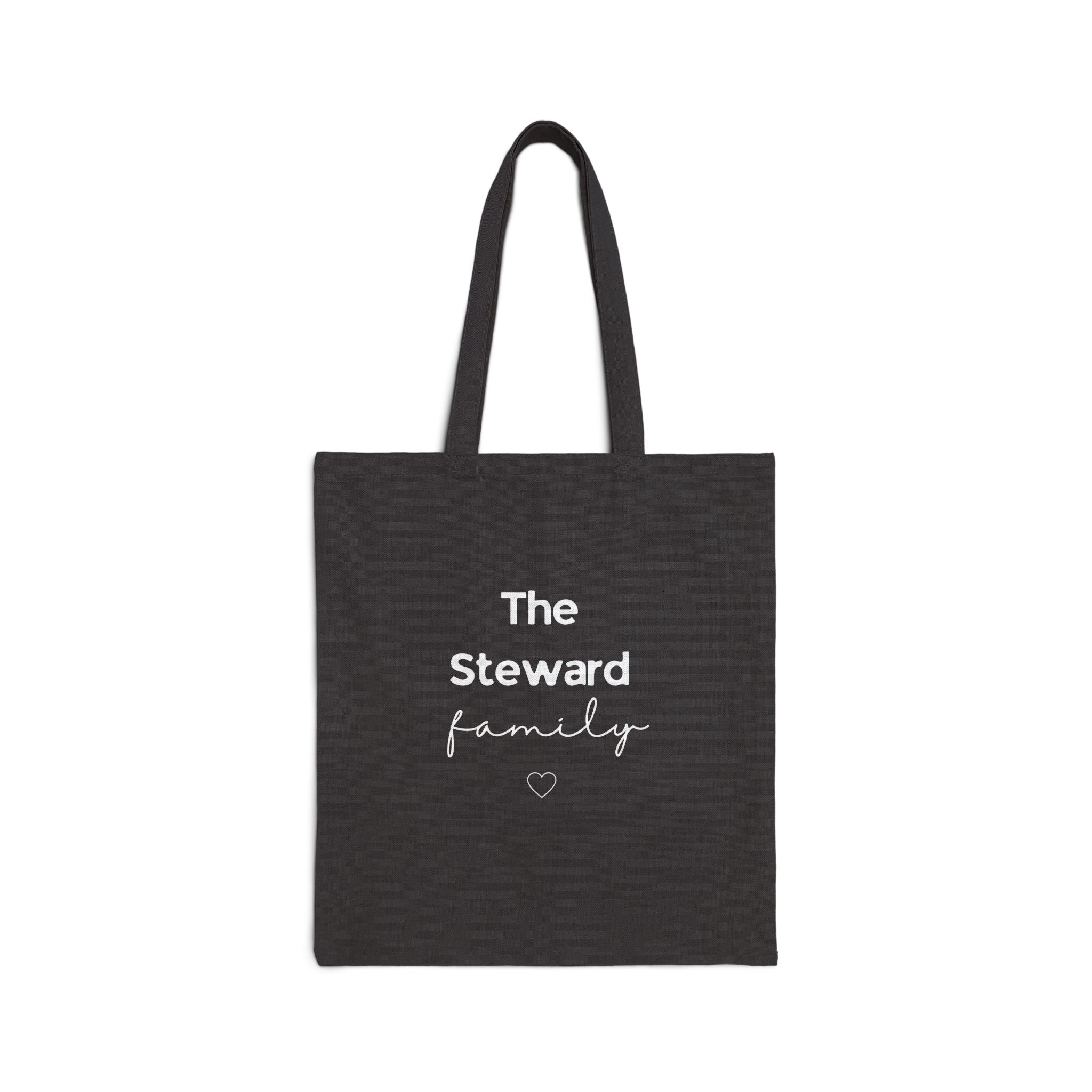 Black canvas tote bag with handles and “The Steward family” text