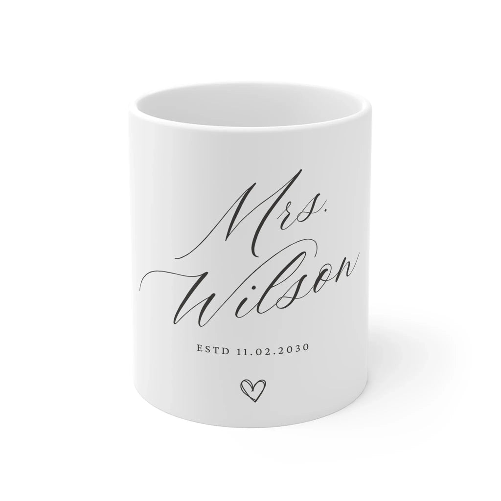 White ceramic mug with 'Mrs Wilson' script and 'ESTD 11.02.2030' with heart
