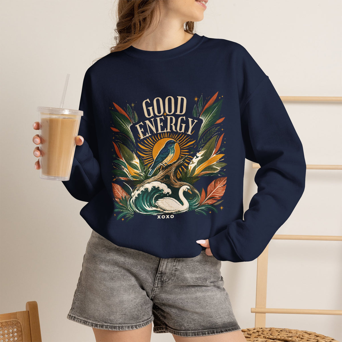Navy unisex sweatshirt with large botanical “Good Energy” front graphic